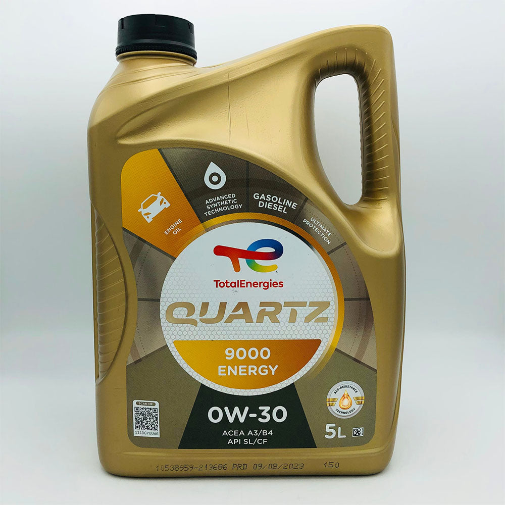 Gold oil bottle with Total Energies branding on a white background