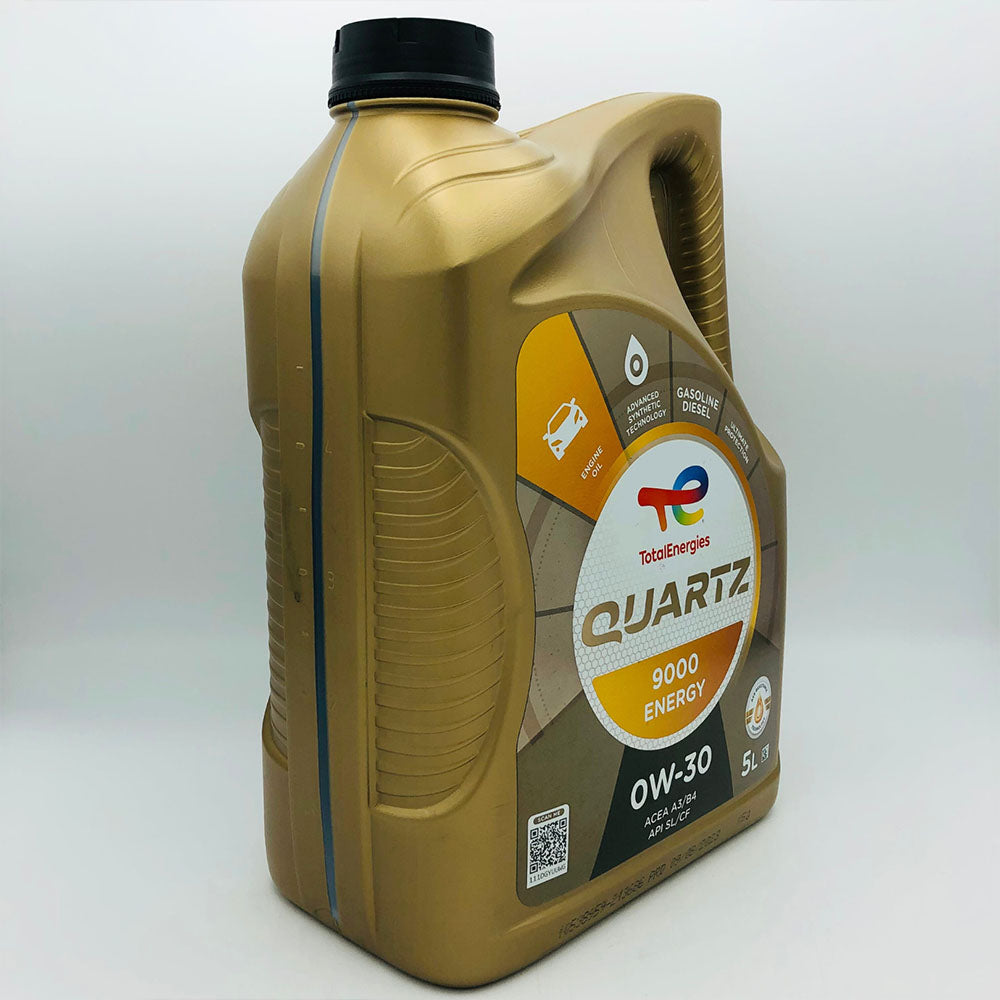 Gold oil bottle with Total Energies logo on a white background